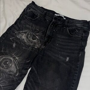 Black Jeans with Subtle Graphic Eye Detailing